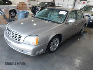 2001 Cadillac DeVille DTS with VIN 1G6KF57911U263913, listed as a IAAI auction lot 41744490 with 100,235 mi miles. Bid and sale history available at carsss.com. Image 2.