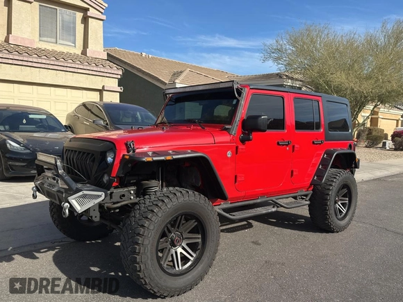 2018 Jeep Wrangler JK Unlimited Sport S with VIN 1C4BJWDG7JL828871, listed as a Copart auction lot 87530425 with 60,958 mi miles and Clean Title. Bid and sale history available at carsss.com. Image 2.