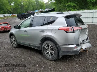 2018 Toyota RAV4 XLE with VIN JTMRFREV2JJ200677, listed as a Copart auction lot 59660535 with 82,283 mi miles and Salvage title. Bid and sale history available at DreamBid. Image 2.