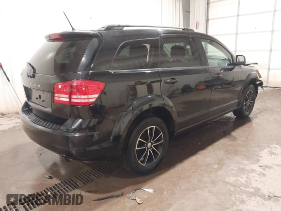 2017 Dodge Journey SE z VIN 3C4PDCAB4HT695490, wystawiony jako IAAI lot #41301719 z przebiegiem 103 642 mil mil oraz . Historia ofert i sprzedaży dostępna na DreamBid. Obrazek 4.