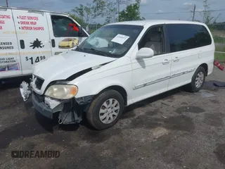 2005 Kia Sedona LX with VIN KNDUP132056702484, listed as a IAAI auction lot 42099572 with 195,528 mi miles and . Bid and sale history available at DreamBid. Image 2.
