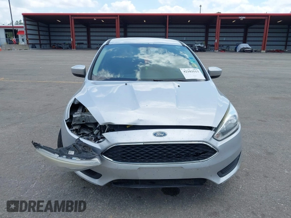 2018 Ford Focus SE z VIN 1FADP3FE9JL241661, wystawiony jako IAAI lot #42103513 z przebiegiem 117 003 mil mil oraz . Historia ofert i sprzedaży dostępna na DreamBid. Obrazek 12.