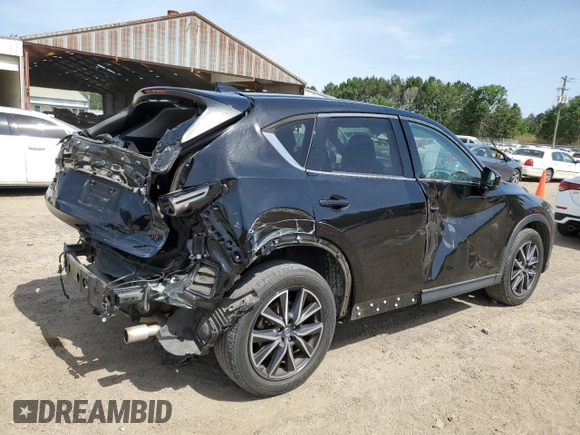2018 Mazda CX-5 Grand Touring z VIN JM3KFADM2J1381752, wystawiony jako Copart lot #56889835 z przebiegiem 96 820 mil mil oraz Szkoda całkowita • Salvage title. Historia ofert i sprzedaży dostępna na DreamBid. Obrazek 3.