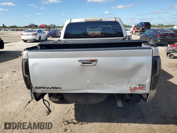 2012 GMC Canyon SLE1 with VIN 1GTD5MFE9C8108474, listed as a Copart auction lot 82650124 with 219,772 mi miles and Salvage Title. Bid and sale history available at carsss.com. Image 6.