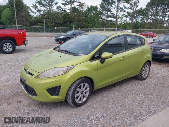 2011 Ford Fiesta SE with VIN 3FADP4EJXBM164397, listed as a IAAI auction lot 42046591 with 118,953 mi miles. Bid and sale history available at carsss.com. Image 2.