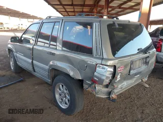 1998 Jeep Grand Cherokee Laredo with VIN 1J4GZ58S9WC136684, listed as a IAAI auction lot 41444103 with 1 mi miles. Bid and sale history available at carsss.com. Image 3.