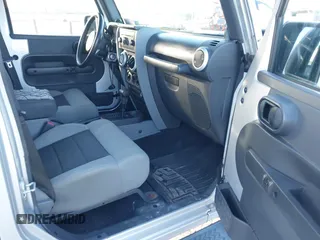 2010 Jeep Wrangler Unlimited Sahara with VIN 1J4BA5H14AL230604, listed as a IAAI auction lot 41884346 with 97,060 mi miles. Bid and sale history available at carsss.com. Image 5.