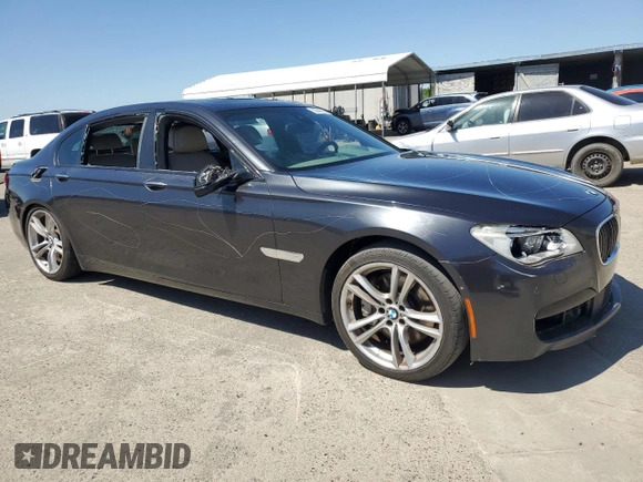 2014 BMW 7 Series ALPINA B7 with VIN WBAYE8C55ED136454, listed as a Copart auction lot 55589525 with 119,761 mi miles and Salvage title. Bid and sale history available at DreamBid. Image 4.