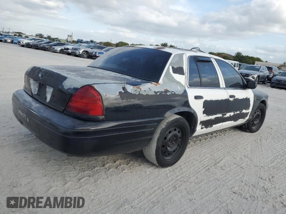 2005 Ford Police Interceptor with VIN 2FAFP71W35X128684, listed as a Copart auction lot 54002165 with 144,766 mi miles and Clean title. Bid and sale history available at DreamBid. Image 3.