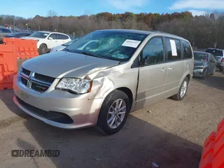 2014 Dodge Grand Caravan SXT with VIN 2C4RDGCG0ER210186, listed as a IAAI auction lot 40813319 with 100,230 mi miles and . Bid and sale history available at DreamBid. Image 2.
