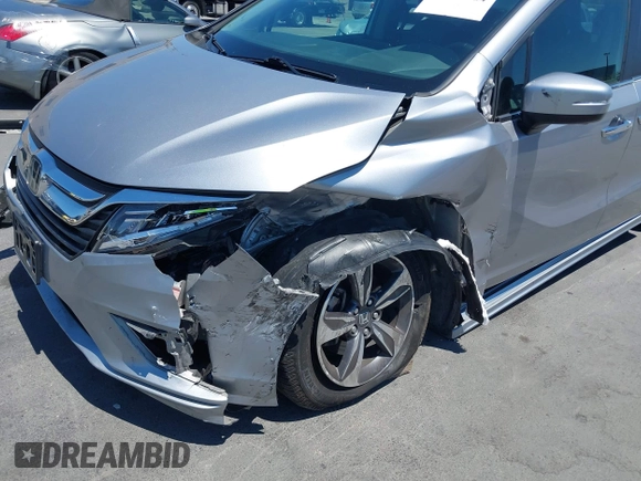 2018 Honda Odyssey Touring with VIN 5FNRL6H81JB022975, listed as a IAAI auction lot 42653304 with 210,137 mi miles and . Bid and sale history available at DreamBid. Image 6.