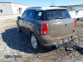2014 MINI Countryman S with VIN WMWZC3C5XEWP52054, listed as a IAAI auction lot 41452354 with 104,873 mi miles and . Bid and sale history available at DreamBid. Image 3.