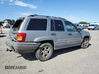 2000 Jeep Grand Cherokee Laredo with VIN 1J4G248S7YC321298, listed as a Copart auction lot 58036255 with 292,779 mi miles and Salvage title. Bid and sale history available at DreamBid. Image 3.