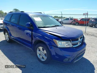 2012 Dodge Journey SXT z VIN 3C4PDCBGXCT296893, wystawiony jako IAAI lot #41841305 z przebiegiem 155 563 mil mil oraz . Historia ofert i sprzedaży dostępna na DreamBid. Obrazek 1.