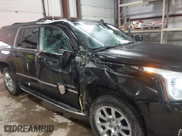 2015 GMC Yukon XL SLT with VIN 1GKS2HKC9FR175011, listed as a IAAI auction lot 41510519 with 194,136 mi miles. Bid and sale history available at carsss.com. Image 6.