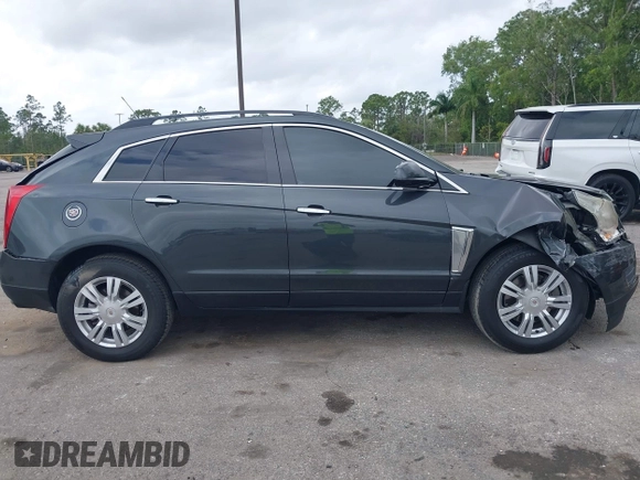 2015 Cadillac SRX with VIN 3GYFNAE30FS569009, listed as a IAAI auction lot 41718522 with 104,448 mi miles and . Bid and sale history available at DreamBid. Image 13.