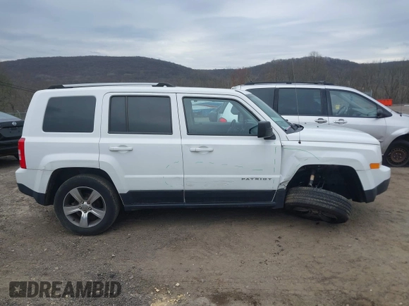 2016 Jeep Patriot High Altitude Edition with VIN 1C4NJRFB3GD753248, listed as a IAAI auction lot 42005423 with 165,229 mi miles. Bid and sale history available at carsss.com. Image 13.