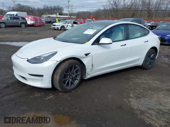 2023 Tesla Model 3 z VIN 5YJ3E1EA8PF671613, wystawiony jako IAAI lot #41737438 z przebiegiem 21 405 mil mil oraz . Historia ofert i sprzedaży dostępna na DreamBid. Obrazek 2.