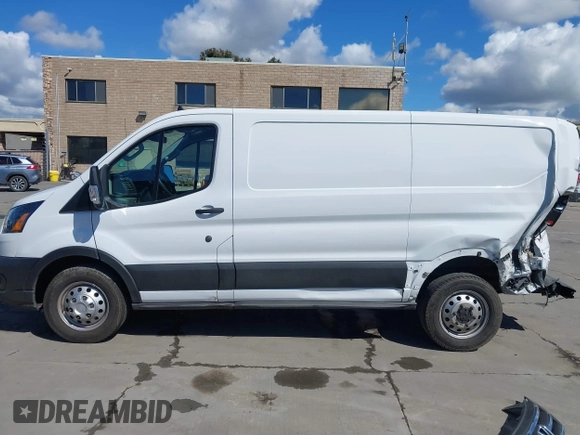 2021 Ford Transit Cargo with VIN 1FTBR2Y80MKA35393, listed as a IAAI auction lot 41732236 with 24,799 mi miles and . Bid and sale history available at DreamBid. Image 14.