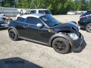 2015 MINI Cooper Coupe with VIN WMWSX1C52FT508184, listed as a Copart auction lot 60639664 with 95,502 mi miles and Salvage Title. Bid and sale history available at carsss.com. Image 4.