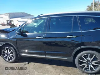 2022 Honda Pilot Touring 7-Passenger with VIN 5FNYF6H65NB030018, listed as a IAAI auction lot 41774147 with 57,391 mi miles. Bid and sale history available at carsss.com. Image 14.