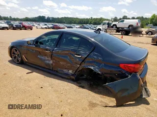 2018 BMW 5 Series M550i xDrive with VIN WBAJB9C54JB286450, listed as a Copart auction lot 61232125 with 88,479 mi miles and Salvage title. Bid and sale history available at DreamBid. Image 2.