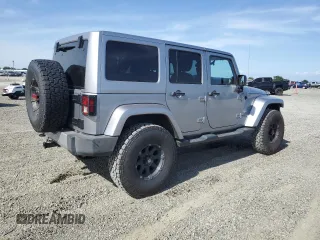 2014 Jeep Wrangler Unlimited Sahara with VIN 1C4HJWEG1EL126611, listed as a Copart auction lot 57169485 with 122,000 mi miles and Salvage title. Bid and sale history available at DreamBid. Image 3.