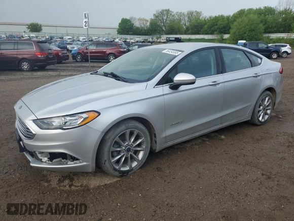 2017 Ford Fusion Hybrid SE z VIN 3FA6P0LU4HR384645, wystawiony jako Copart lot #56454995 z przebiegiem 165 322 mil mil oraz Czysty tytuł • Clean title. Historia ofert i sprzedaży dostępna na DreamBid. Obrazek 1.