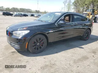 2014 BMW 5 Series GT 550i xDrive with VIN WBA5M0C5XED084908, listed as a Copart auction lot 50619945 with 97,680 mi miles and Salvage Title. Bid and sale history available at carsss.com. Image 1.