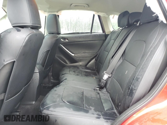 2016 Mazda CX-5 Grand Touring z VIN JM3KE2DY8G0623423, wystawiony jako Copart lot #58599545 z przebiegiem 131 932 mil mil oraz Szkoda całkowita • Salvage title. Historia ofert i sprzedaży dostępna na DreamBid. Obrazek 11.