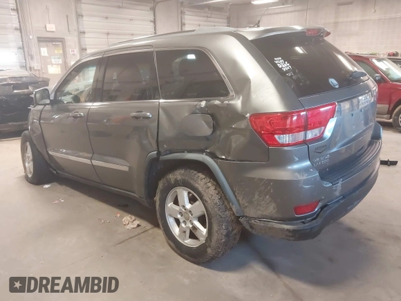 2012 Jeep Grand Cherokee Laredo with VIN 1C4RJFAG3CC209142, listed as a IAAI auction lot 41978296 with 201,796 mi miles. Bid and sale history available at carsss.com. Image 3.