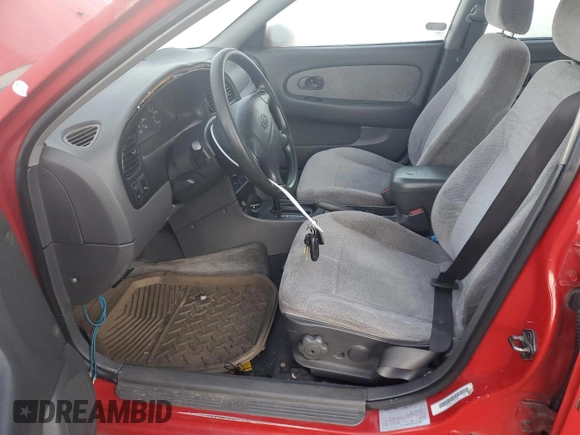 2001 Kia Sephia z VIN KNAFB121715066725, wystawiony jako Copart lot #86552964 z przebiegiem 76 915 mil mil oraz Tytuł czysty. Historia ofert i sprzedaży dostępna na DreamBid. Obrazek 7.