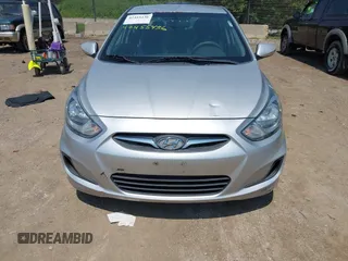 2014 Hyundai Accent GLS z VIN KMHCT4AE1EU637366, wystawiony jako IAAI lot #42455436 z przebiegiem 121 764 mil mil oraz . Historia ofert i sprzedaży dostępna na DreamBid. Obrazek 6.