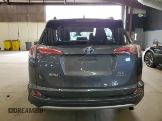 2016 Toyota RAV4 Hybrid XLE with VIN JTMRJREV0GD035203, listed as a Copart auction lot 54300225 with 153,369 mi miles and Salvage Title. Bid and sale history available at carsss.com. Image 6.