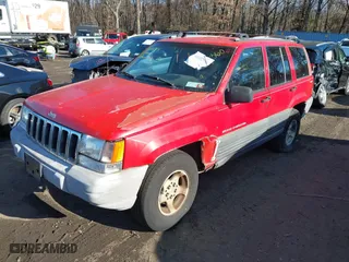 1997 Jeep Grand Cherokee Laredo with VIN 1J4GZ58S0VC550242, listed as a IAAI auction lot 41032114 with 185,307 mi miles. Bid and sale history available at carsss.com. Image 6.