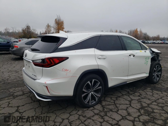 2020 Lexus RX 350L with VIN JTJHZKEA6L2014576, listed as a Copart auction lot 82706154 with 59,775 mi miles and Salvage title. Bid and sale history available at DreamBid. Image 3.