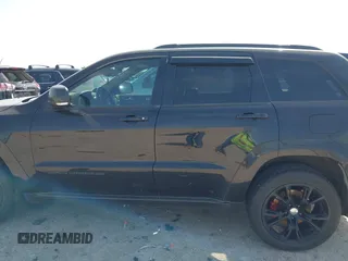 2015 Jeep Grand Cherokee Summit with VIN 1C4RJFJM1FC867861, listed as a IAAI auction lot 42034207 with 92,205 mi miles and . Bid and sale history available at DreamBid. Image 14.