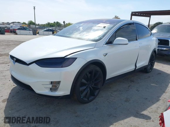 2021 Tesla Model X Long Range Plus with VIN 5YJXCBE23MF321243, listed as a IAAI auction lot 42100580 with 59,878 mi miles and . Bid and sale history available at carsss.com. Image 2.