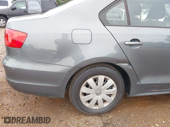 2014 Volkswagen Jetta S z VIN 3VW2K7AJ2EM313510, wystawiony jako IAAI lot #42334212 z przebiegiem 180 245 mil mil oraz . Historia ofert i sprzedaży dostępna na DreamBid. Obrazek 13.