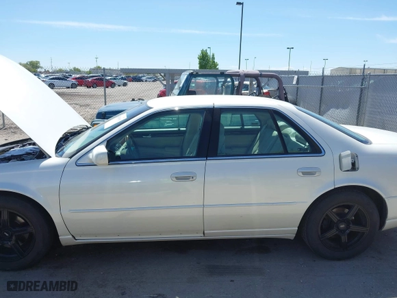 2003 Cadillac Seville Touring STS with VIN 1G6KY54963U110607, listed as a IAAI auction lot 42080691 with 79,605 mi miles. Bid and sale history available at carsss.com. Image 6.