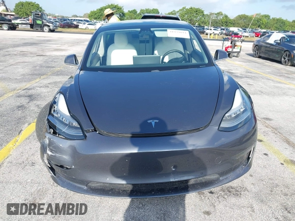 2020 Tesla Model 3 Standard Range Plus with VIN 5YJ3E1EA0LF744046, listed as a IAAI auction lot 41939894 with 102,576 mi miles. Bid and sale history available at carsss.com. Image 12.