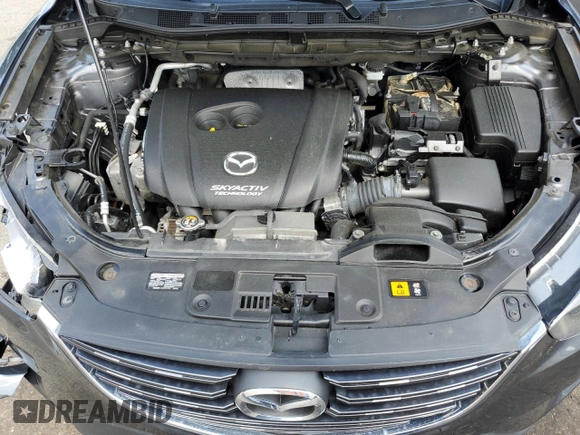2016 Mazda CX-5 Sport z VIN JM3KE2BY4G0632946, wystawiony jako Copart lot #61447435 z przebiegiem 178 492 mil mil oraz Szkoda całkowita • Salvage title. Historia ofert i sprzedaży dostępna na DreamBid. Obrazek 12.