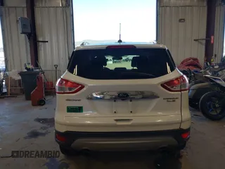 2016 Ford Escape Titanium with VIN 1FMCU9J94GUC28648, listed as a IAAI auction lot 42043761 with 82,509 mi miles and . Bid and sale history available at DreamBid. Image 16.