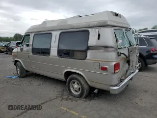 1992 Chevrolet Chevy Van z VIN 1GBEG25K2N7130047, wystawiony jako Copart lot #68682724 z przebiegiem 143 585 mil mil oraz Szkody całkowita. Historia ofert i sprzedaży dostępna na DreamBid. Obrazek 2.