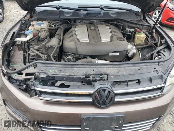2012 Volkswagen Touareg Lux с VIN WVGEK9BPXCD012003, выставлен на аукционе Copart как лот 54910865 с пробегом 106 465 миль миль и Списание • Salvage title. История ставок и продаж доступна на DreamBid. Изображение 12.