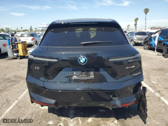 2025 BMW iX xDrive50 with VIN WB523CF05SCT96190, listed as a Copart auction lot 52585415 with 1,894 mi miles and Salvage Title. Bid and sale history available at carsss.com. Image 6.