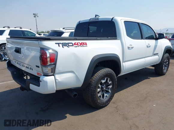 2023 Toyota Tacoma SR with VIN 3TMCZ5AN7PM630874, listed as a IAAI auction lot 40298041 with 8,635 mi miles and . Bid and sale history available at DreamBid. Image 4.