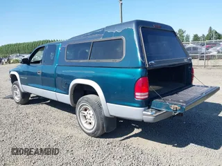1999 Dodge Dakota SLT with VIN 1B7GG22Y2XS157214, listed as a IAAI auction lot 39776504 with 144,928 mi miles and . Bid and sale history available at carsss.com. Image 3.