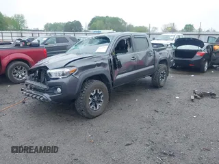 2022 Toyota Tacoma SR with VIN 3TMCZ5AN1NM476353, listed as a IAAI auction lot 41938107 with 51,782 mi miles and . Bid and sale history available at DreamBid. Image 2.