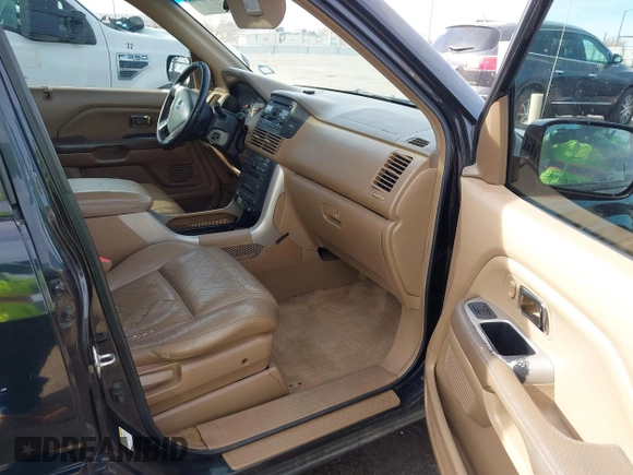 2005 Honda Pilot EX-L with RES with VIN 2HKYF18605H545609, listed as a IAAI auction lot 41626754 with 235,647 mi miles. Bid and sale history available at carsss.com. Image 5.